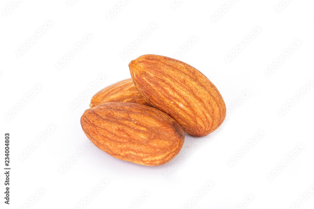 heap almonds on white background. heap almonds on white background.