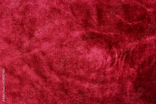 velvet texture background red color. Christmas festive baskground. expensive luxury, fabric, material, cloth.Copy space. photo