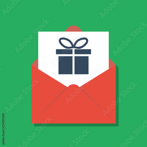 gift box in opened red xmas envelope, secret santa concept