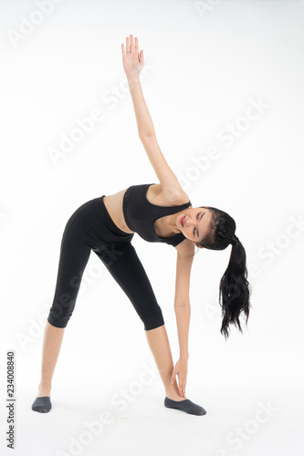 Sporty young asian woman doing yoga practice isolated on white background - concept healthy life fitness for slim.