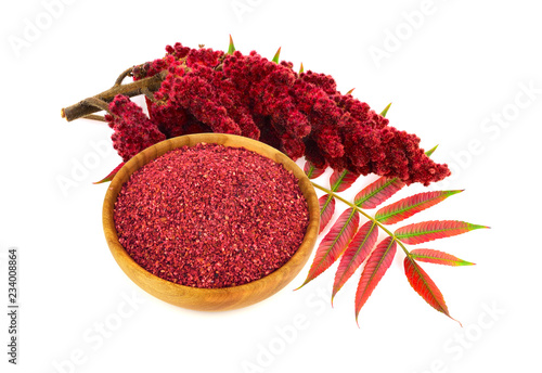 Dry Ground Sumac Spice with Drupe and Leaves. Isolated on White Background.