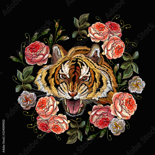 Fototapeta Naklejka Na Ścianę i Meble -  Embroidery tiger head and beautiful roses flowers. Clothes, textile design template