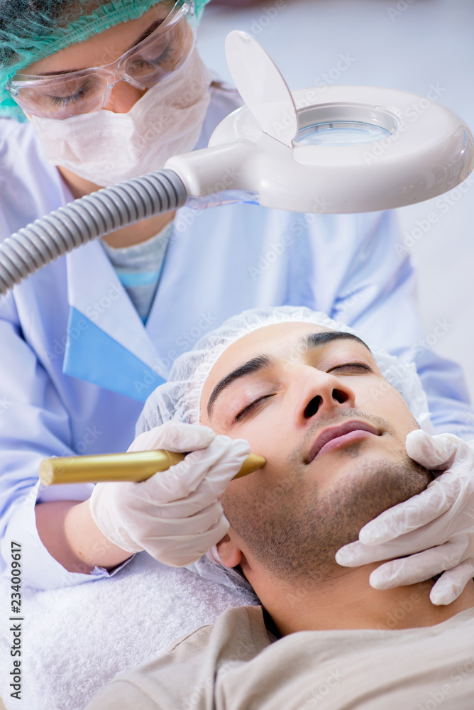 Man visiting dermatologyst for laser scar removal Man visiting dermatologyst for laser scar removal