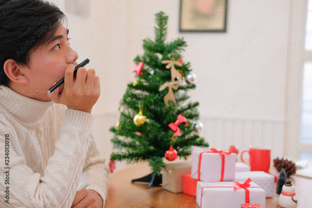 man thinking with pensive expression. christmas decoration at xmas new year holiday celebration. man thinking with pensive expression. christmas decoration at xmas new year holiday celebration.