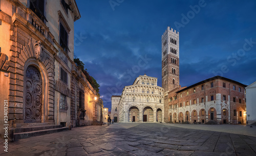 Lucca, Italy. Panorama of Piazza San Martino square with Lucca Cathedral at dusk photo