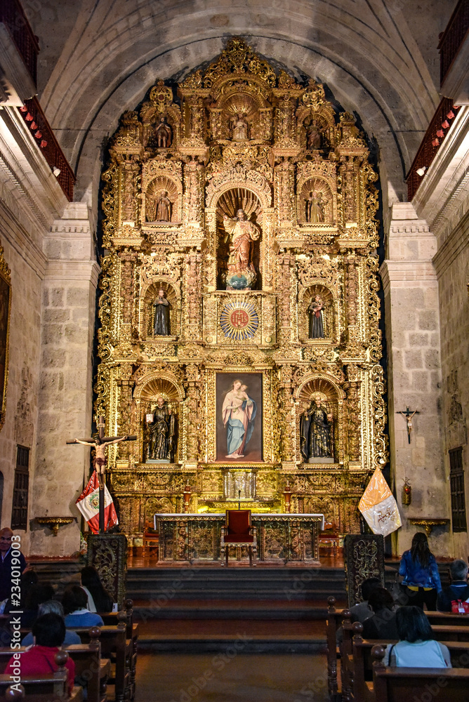 Arequipa, Peru - October 6, 2018 - Interior of Jesuit Church La compania. One of the oldest in the city noted for its ornate facade and main altar covered in gold leaf.