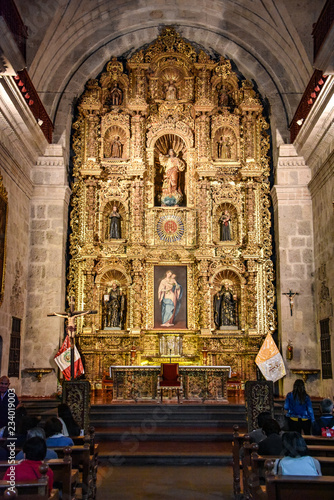 Arequipa, Peru - October 6, 2018 - Interior of Jesuit Church La compania. One of the oldest in the city noted for its ornate facade and main altar covered in gold leaf.