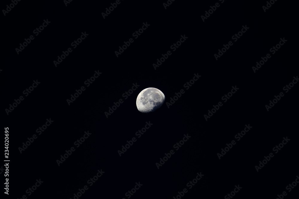 The moon floating in the night sky The moon floating in the night sky