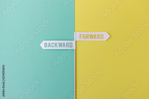 Two arrows showing in opposite directions: Forward vs backward photo