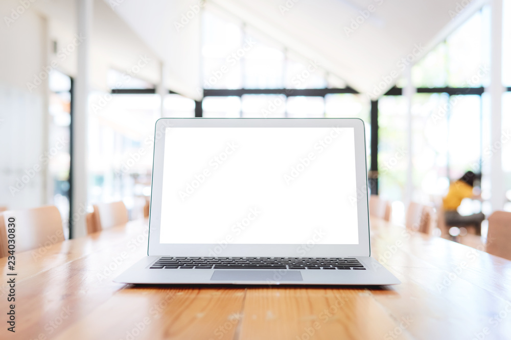 workplace of business with laptop blank white screen at meeting room. close up hands on a keyboard.Top view,Workplace strategy Concept. workplace of business with laptop blank white screen at meeting room. close up hands on a keyboard.Top view,Workplace strategy Concept.