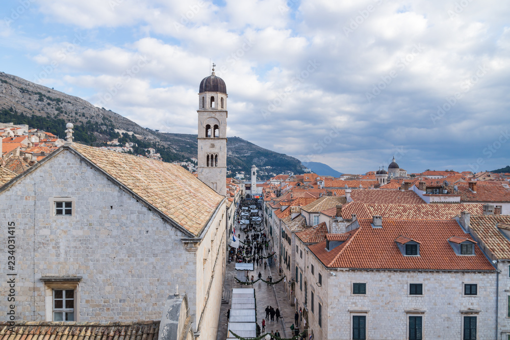 View over the roofs of Dubrovnik with street full of christmas stalls, Croatia