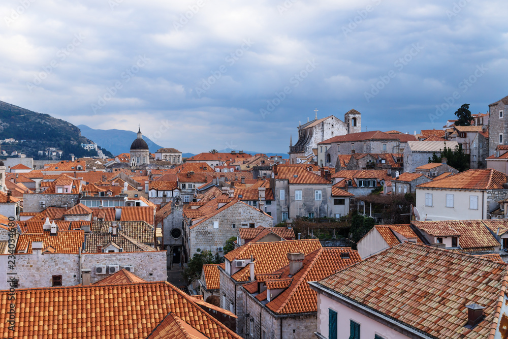 View over the old city Dubrovnik with cathedral and churches with mountains, Croatia