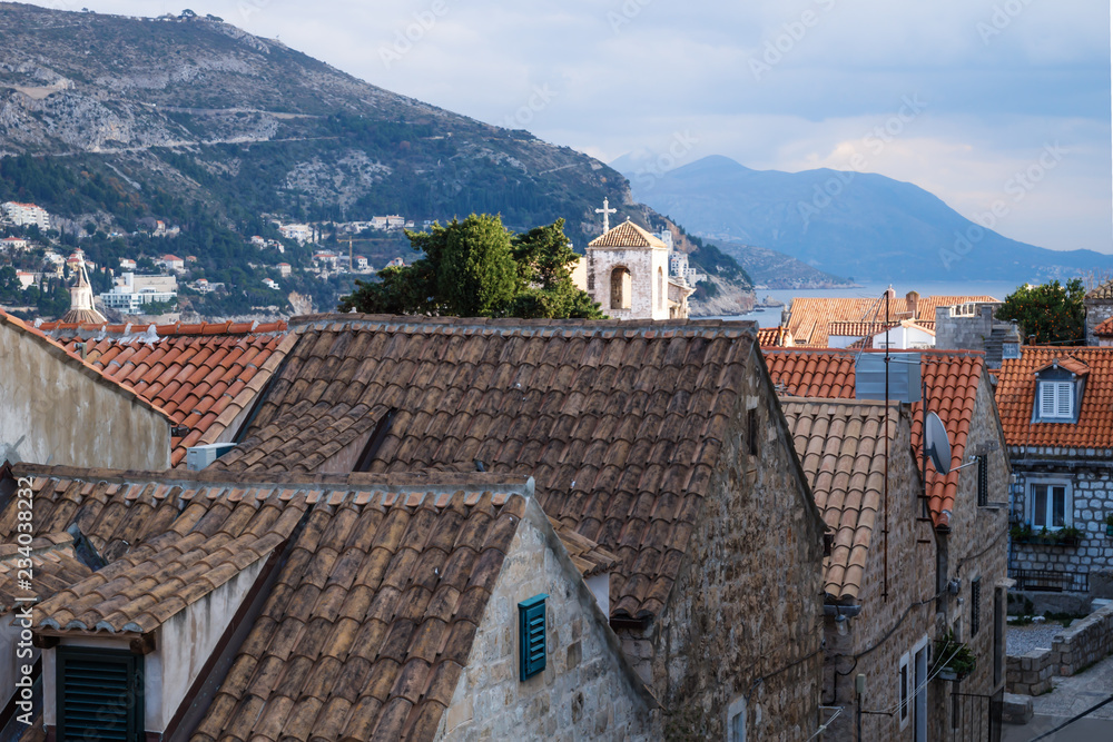 View over the old city Dubrovnik with ancient roofs and mountains, Croatia