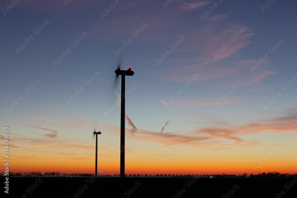 Obraz premium Windmill Wind Power New Energy Sunset Sky Evening