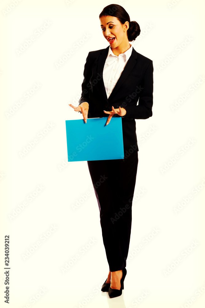 Businesswoman holding a binder Businesswoman holding a binder