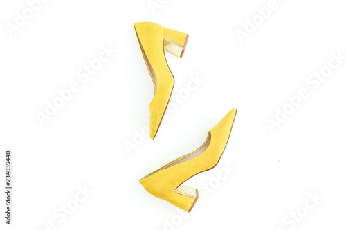 Women fashion. Female concept with yellow shoes on white. Flat lay, top view.