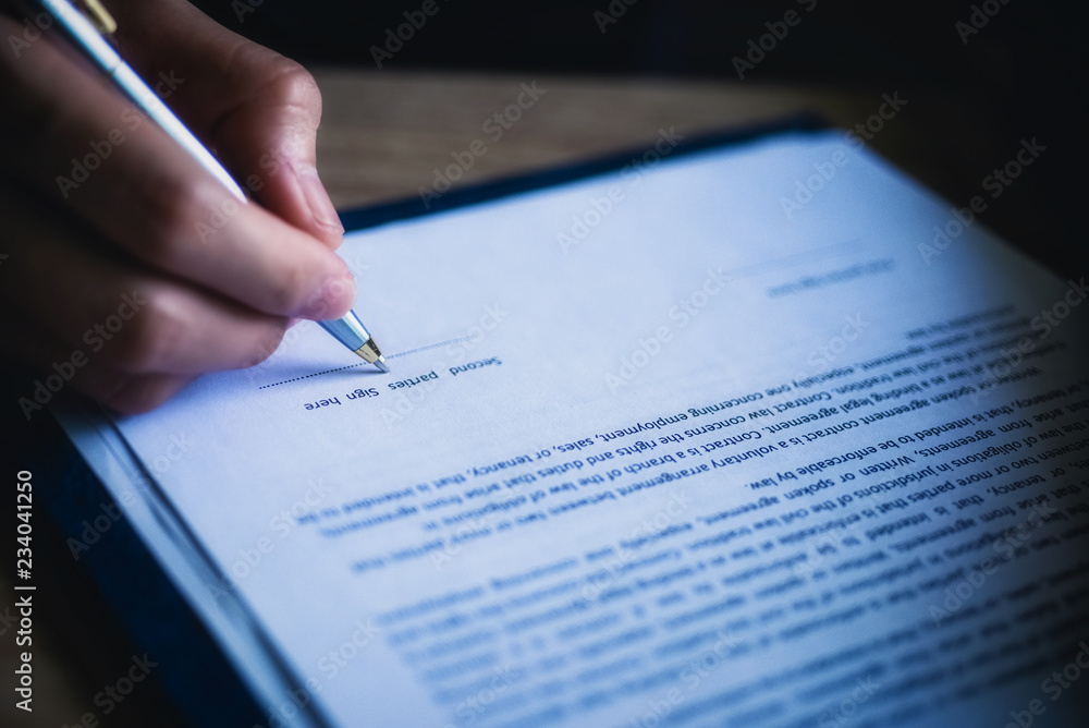Business contract working hard with document contract at the desk. Justice and legal law concept. Business contract working hard with document contract at the desk. Justice and legal law concept.