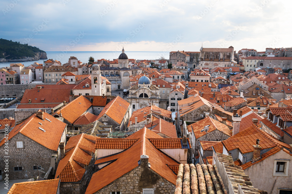 View over the roofs of old town Dubrovnik with church towers and ocean in winter, Croatia