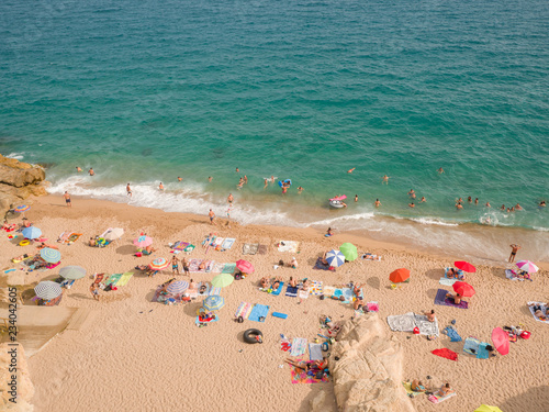 People at beach in Calella city. Spain. photo