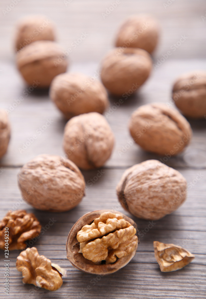 Walnuts kernels on grey wooden background. Walnut healthy food Walnuts kernels on grey wooden background. Walnut healthy food