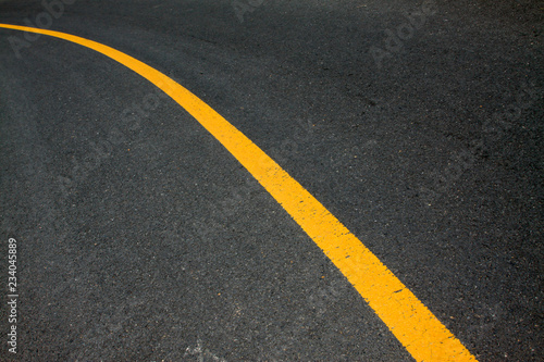Yellow line on the asphalt road