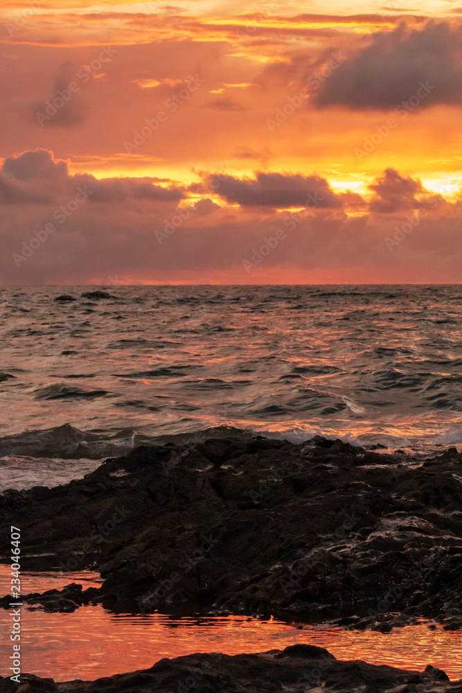 A beautiful, colorful tropical sunset over the ocean