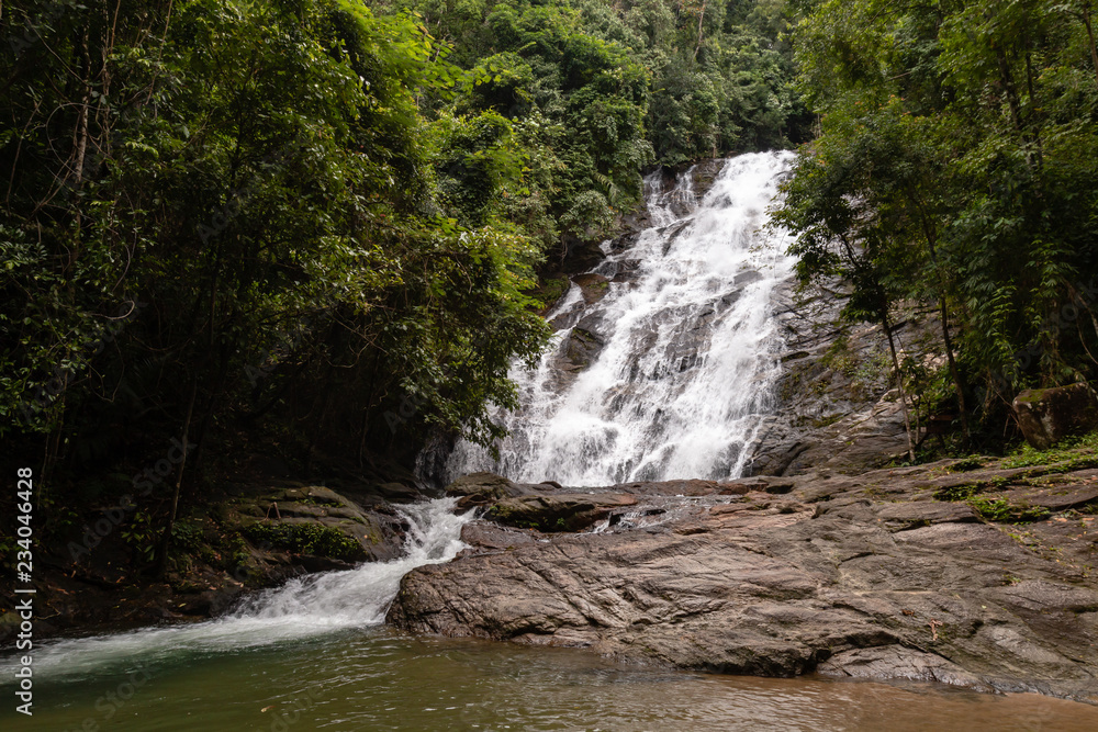 Beautiful waterfall flowing through a tropical rain forest in Thailand (Ton Prai, Lam Ru, Thailand) Beautiful waterfall flowing through a tropical rain forest in Thailand (Ton Prai, Lam Ru, Thailand)