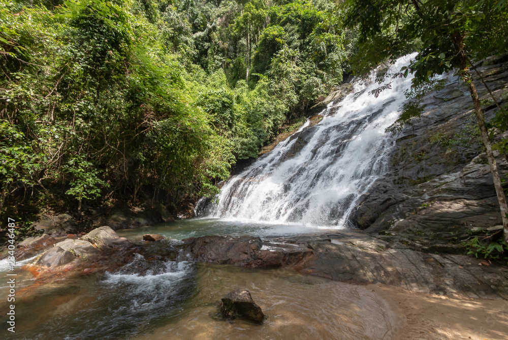 Beautiful waterfall flowing through a tropical rain forest in Thailand (Ton Prai, Lam Ru, Thailand) Beautiful waterfall flowing through a tropical rain forest in Thailand (Ton Prai, Lam Ru, Thailand)
