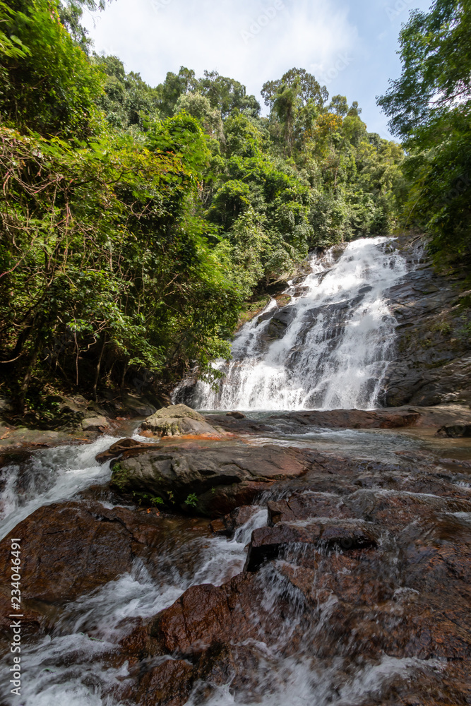 Beautiful waterfall flowing through a tropical rain forest in Thailand (Ton Prai, Lam Ru, Thailand) Beautiful waterfall flowing through a tropical rain forest in Thailand (Ton Prai, Lam Ru, Thailand)