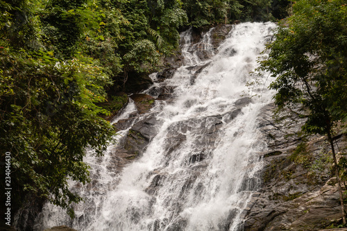 Beautiful waterfall flowing through a tropical rain forest in Thailand (Ton Prai, Lam Ru, Thailand)