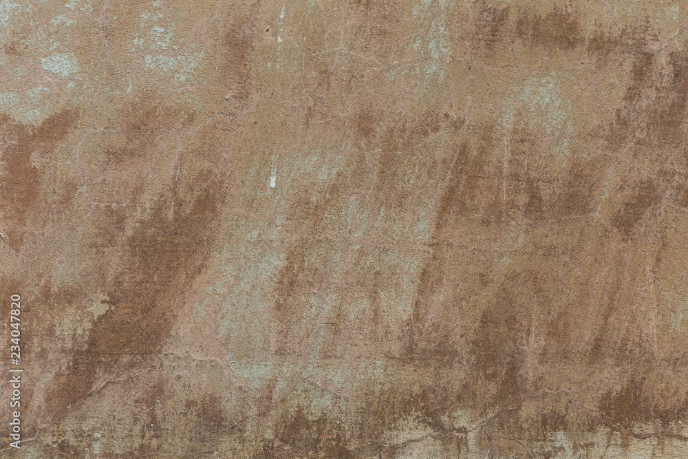 Old plaster walls with remnants of brown paint. Grunge texture. Old plaster walls with remnants of brown paint. Grunge texture.