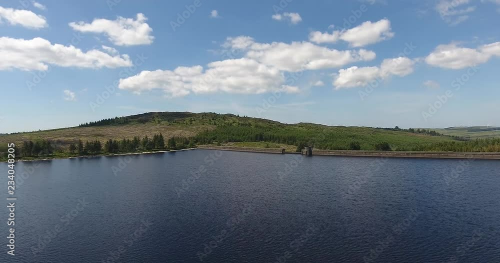 Drone Shot on a Sunny Day over a Small Lake Moving towards Forest Drone Shot on a Sunny Day over a Small Lake Moving towards Forest