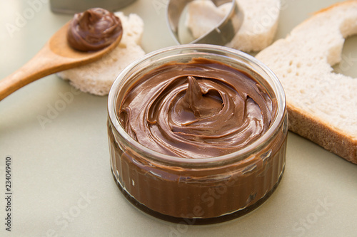 Chocolate hazelnut spread in glass bowl. Hazelnut Nougat cream.
