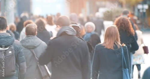 Wallpaper Mural Commuters walking to work with morning sun light in business district, footage of blurred people commuting from back, busy city life Torontodigital.ca