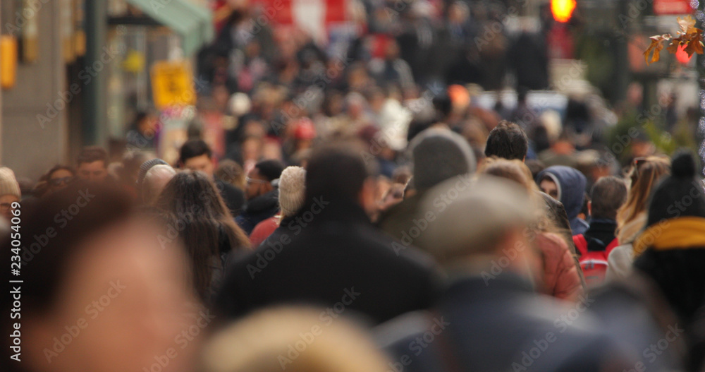 Crowd of people walking street