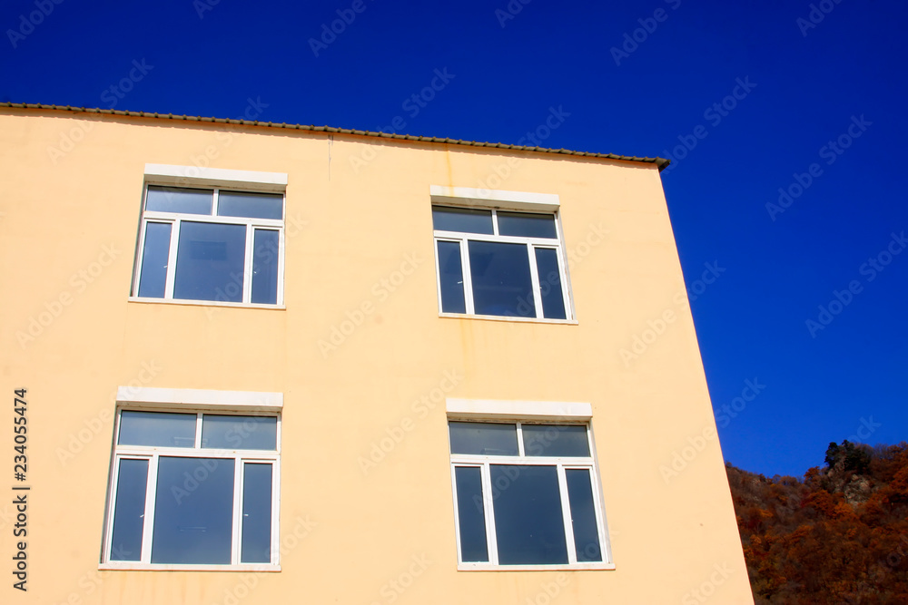 walls and windows under the blue sky
