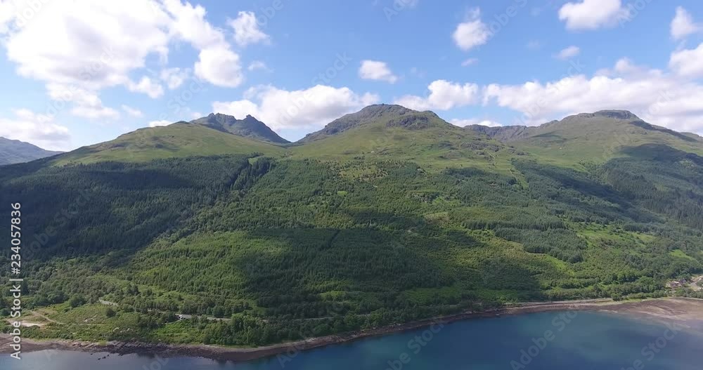 Blue Green Lake Drone Shot with Forested Landscape in Scotland - Aerial View Loch Fyne in the Highlands Blue Green Lake Drone Shot with Forested Landscape in Scotland - Aerial View Loch Fyne in the Highlands