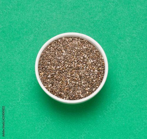 Chia seeds - Salvia hispánica. Green background