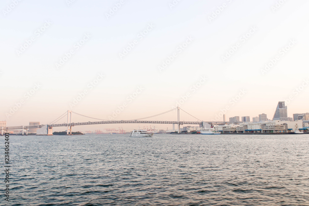 Single of boat and rainbow bridge at sumida river viewpoint in tokyo