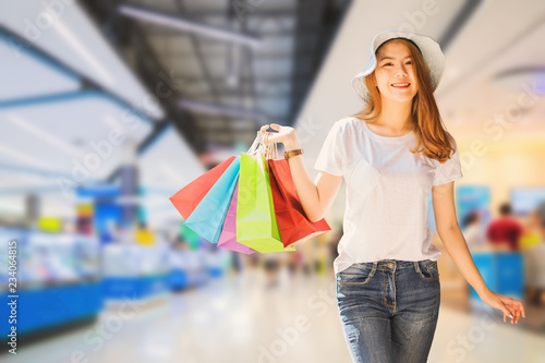 Young woman with shopping bags walking and shopping in the shop, Woman lifestyle concept
