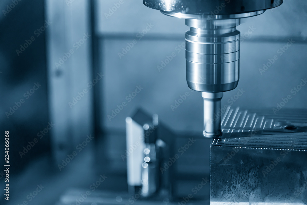 The CNC milling machine cutting the mold part with the index-able ball end mill .The hi-Technology manufacturing process. The CNC milling machine cutting the mold part with the index-able ball end mill .The hi-Technology manufacturing process.