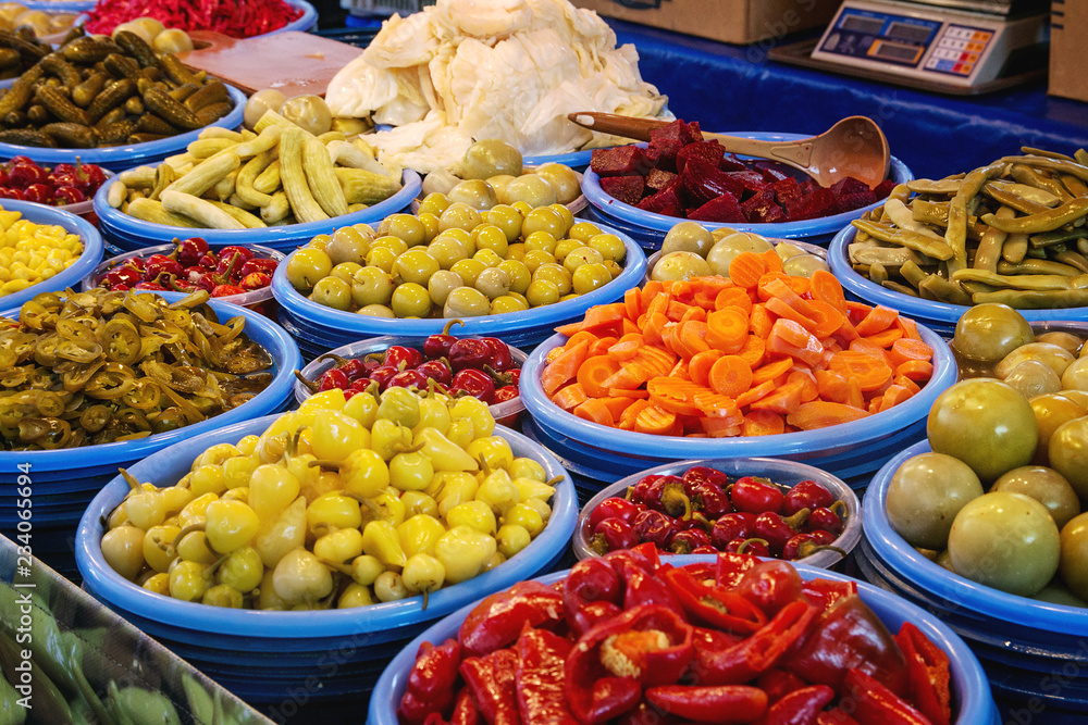 Turkish farmer market. Pickled vegetables peppers, olives, carrots, cucumbers on the counter