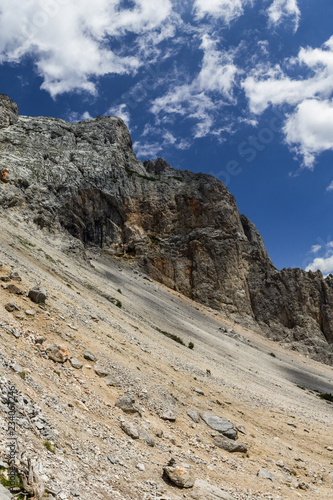 Narrow rock ridge sticking out of the steep slope in Rax Alps