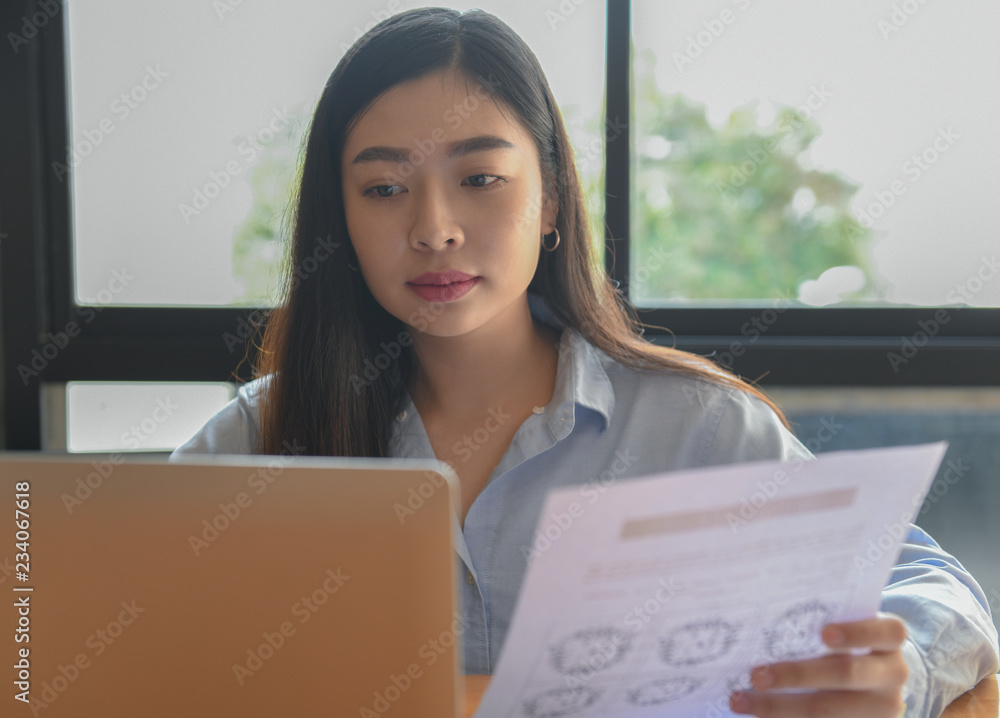 Female office workers using laptops. Female office workers using laptops.