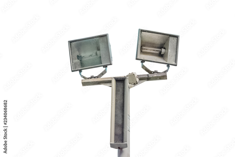 Electric spotlight pole on the street with blue cloudy sky background Electric spotlight pole on the street with blue cloudy sky background