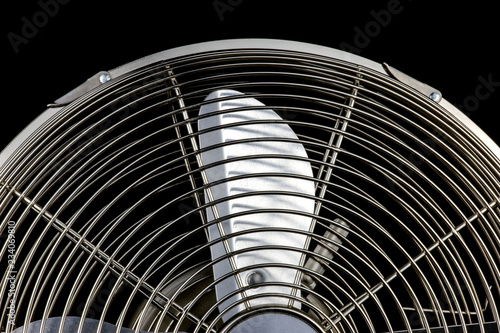 Steel Desk Fan on a Black Background