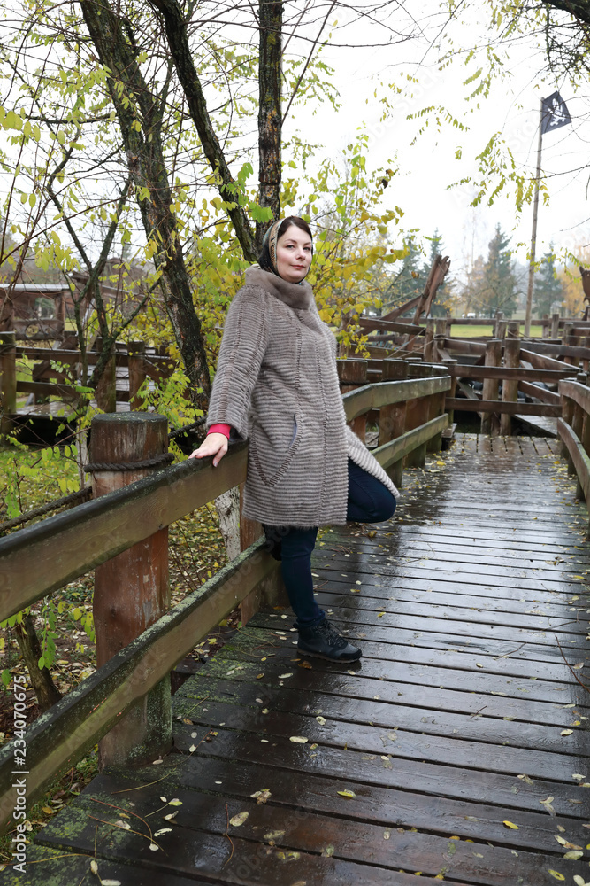 Woman on wooden bridge Woman on wooden bridge