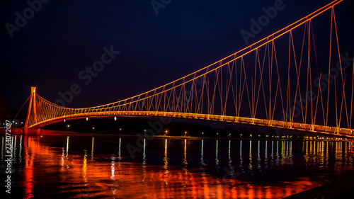 Vászonkép Side view of a colorful modern pedestrian bridge