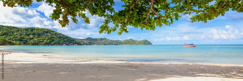 Beautiful amazing incredible tropical beach, white sand blue sky with clouds and reflection of trees on the sand, panorama banner format Beautiful amazing incredible tropical beach, white sand blue sky with clouds and reflection of trees on the sand, panorama banner format