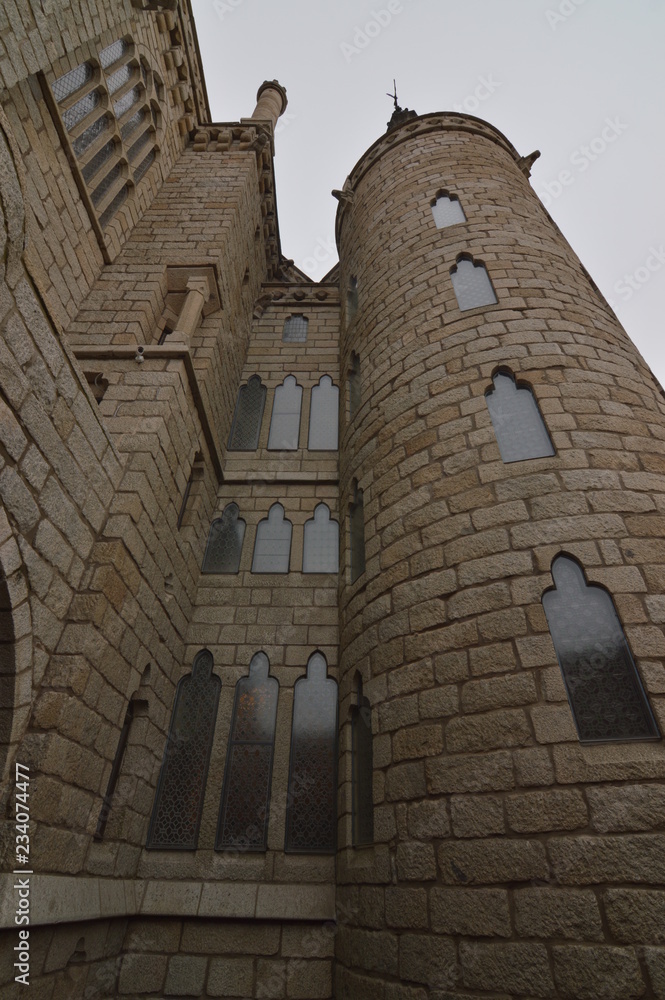 External Towers With Precious Stained Glass Of The Episcopal Palace In Astorga. Architecture, History, Camino De Santiago, Travel, Street Photography. November 1, 2018. Astorga, Leon, Spain. External Towers With Precious Stained Glass Of The Episcopal Palace In Astorga. Architecture, History, Camino De Santiago, Travel, Street Photography. November 1, 2018. Astorga, Leon, Spain.